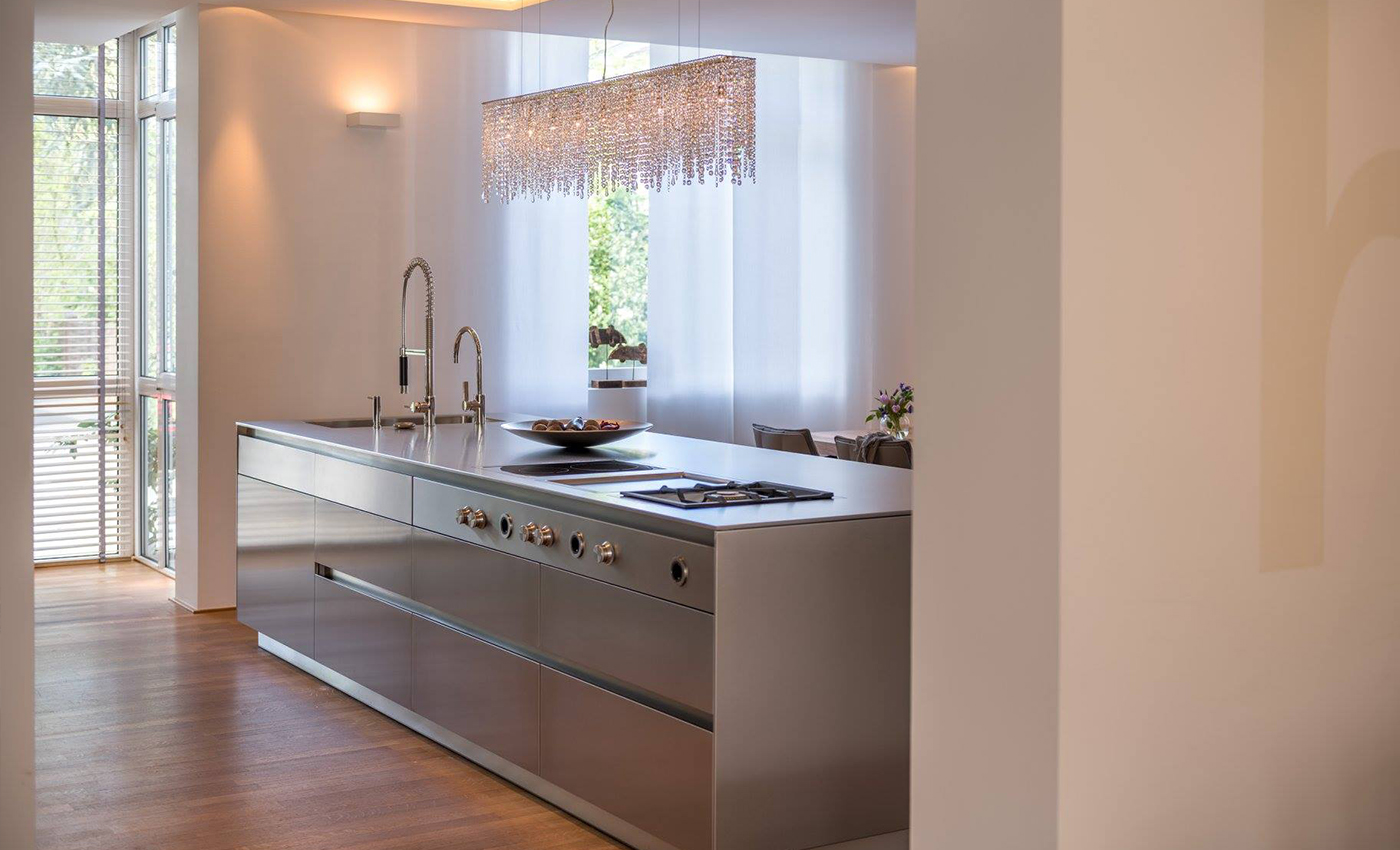 Manooi's crystal lighting hangs over a kitchen island in the Bulthaup showroom in Cologne. 